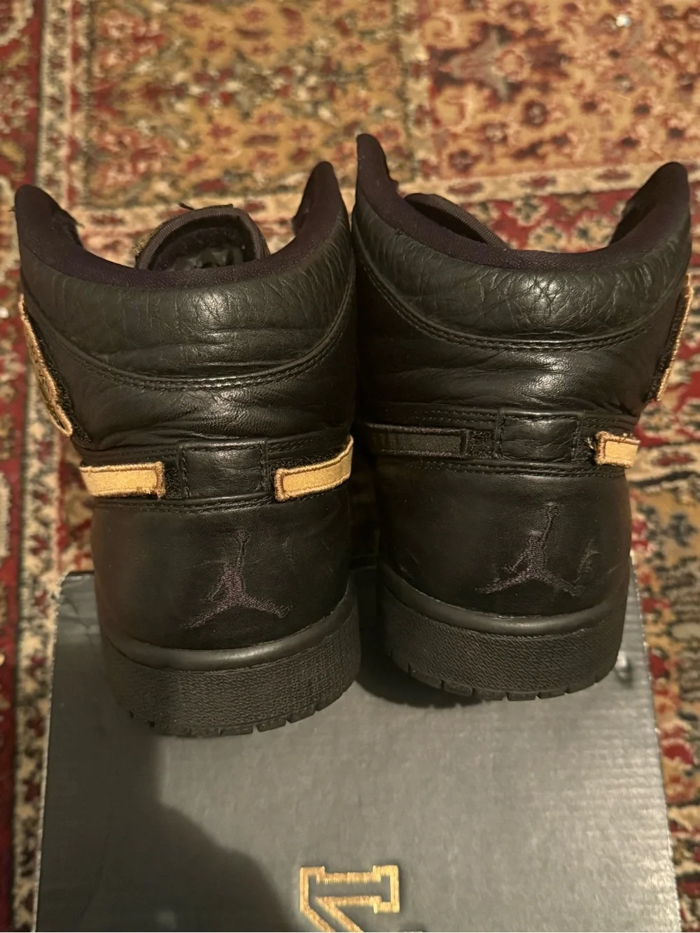 Jordan 1 Retro BHM - Men's High Top Sneakers in Black with Gold Swoosh